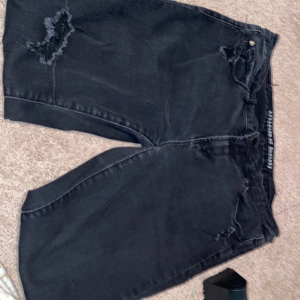 Black articles of society jeans